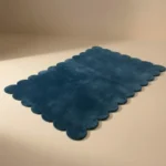 Angled perspective of the Deep Marine rectangular rug showing the plush wool texture and deep blue color.