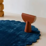 Close up angled perspective of the Deepstone rug highlighting the dense wool pile and deep blue tones.