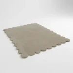 Angled perspective view of the rectangular Moonstone hand tufted wool rug displaying the soft grey color and scalloped border design.