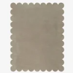 Top down view of the Moonstone grey hand tufted wool rug on a white background showing the rectangular shape and scalloped edges.