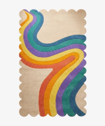 Top down view of the Chromatic Wave rug featuring a beige background with a flowing retro rainbow ribbon design in yellow orange purple and blue.