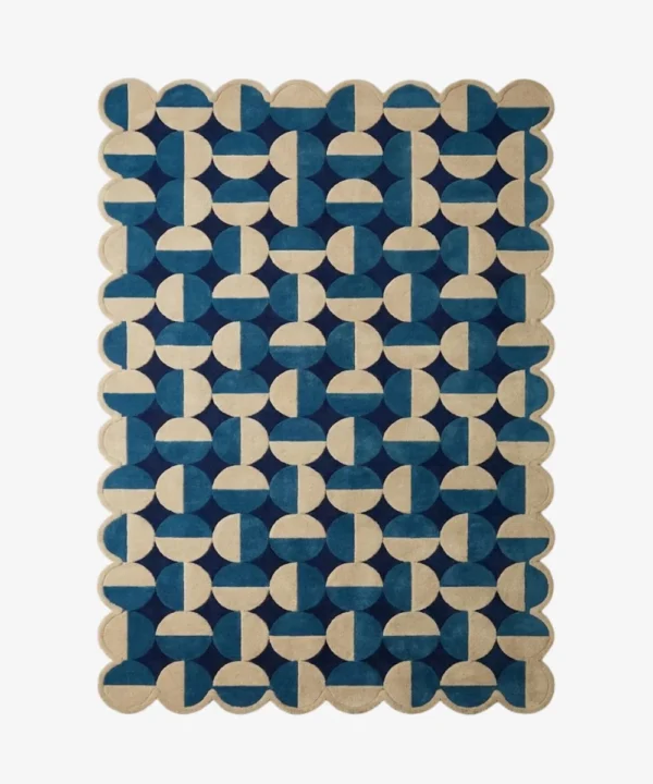 Top down flat lay of the Coastal Mosaic hand tufted rug showing the full repeating pattern of alternating blue and cream geometric shapes.