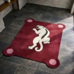 High angle view of the Crimson Prowl rug placed on a dark tiled floor, featuring a rich crimson red background with a striking white panther illustration and unique protruding rounded corners with light pink circles.