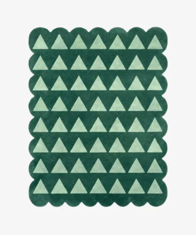 Top down view of the Emerald Steps rug featuring a repeating geometric pattern of light green U-shapes or steps on a deep emerald green wool background, finished with custom scalloped edges.