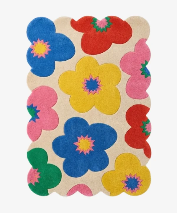 A vibrant and fun multicolor wool area rug with scalloped edges, perfect for adding a dopamine decor touch to a nursery or living space.