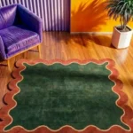 The Forest Frame rug styled in a colorful modern living space, showing how the deep green and rust tones anchor a room with bold furniture and yellow walls.