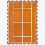 Top down view of the Hearth Grid rug featuring a vibrant terracotta orange wool background with a white geometric line pattern resembling a tennis court layout, finished with playful scalloped edges.