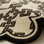 Close-up low angle view of the Heritage Lattice rug, showcasing the plush hand-tufted wool texture.