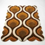 Angled full view of the Honeyed Waves hand tufted rug placed on a white floor, showcasing the bold retro aesthetic and soft wool construction.