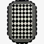 Top down view of the Ivory Lattice rug featuring a classic black and white diamond grid pattern with a geometric border and decorative scalloped edges.