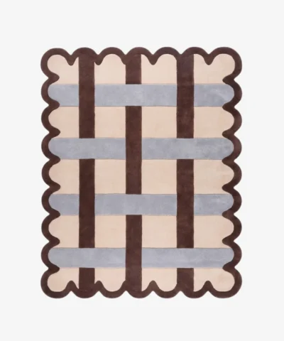 Top down view of the Linen Blend rug featuring a cream wool background with an interlaced grid pattern of dark brown and light grey stripes, framed by a dark brown scalloped border.