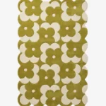 Top down view of the Moss Parade rug featuring an earthy moss green background with a retro grid pattern of white flowers.