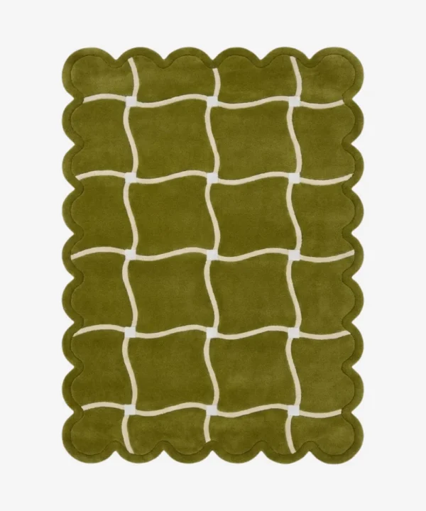 Top down view of the Moss Weave rug featuring a deep moss green wool background with a playful cream wavy grid pattern and custom scalloped edges.