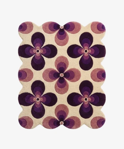 Top down view of the Mulberry Petal rug featuring a retro 70s inspired floral pattern with bold purple and lilac flower motifs on a cream wool background.