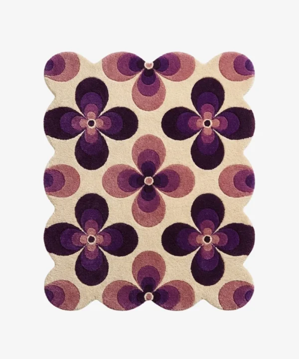 Top down view of the Mulberry Petal rug featuring a retro 70s inspired floral pattern with bold purple and lilac flower motifs on a cream wool background.