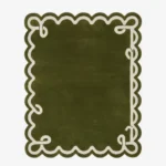 Top down view of the Olive Reverie rug featuring a deep olive green wool background with a decorative cream ribbon border design and elegant custom scalloped edges.