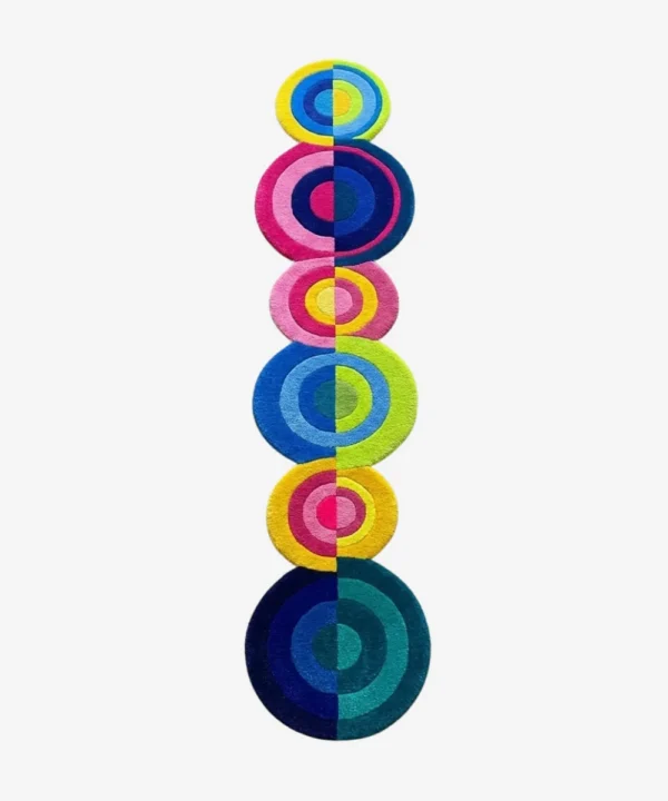 Top down view of the Pastel Pop Rings runner rug on a white background, featuring a playful vertical stack of concentric circles in varying sizes and bright pastel hues of pink, blue, yellow, and green.