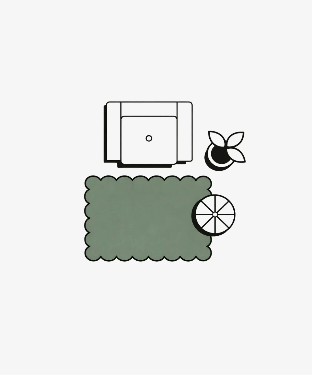 Layout illustration for the ScallopedRugs 4x6ft collection showing a cozy accent setup with an armchair and plant placed next to a small green scalloped rug to define the space.