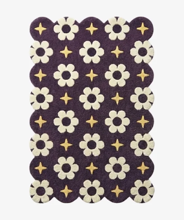 A celestial inspired purple wool rug with scalloped edges, decorated with repeating floral blooms and golden starlight motifs.