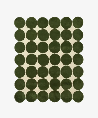 Top down view of the Still Meadow rug featuring a bold geometric pattern of large deep green circles arranged in a grid on a cream wool background.