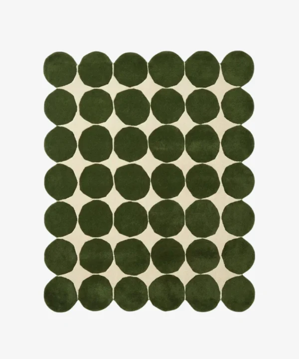 Top down view of the Still Meadow rug featuring a bold geometric pattern of large deep green circles arranged in a grid on a cream wool background.