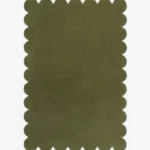 Top down flat lay view of the Stone Whisper rug featuring a solid earthy olive green color and decorative scalloped borders isolated on a white background.