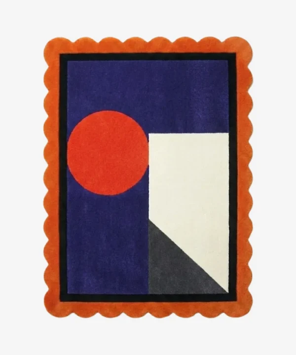 Top down view of the Amber Solis rug featuring a radiant sun-inspired geometric design in warm amber and golden yellow wool, finished with custom scalloped edges.