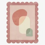 Top down view of the Blush Aurea rug featuring a luxurious blend of soft blush pink and golden aurea yellow accents on a plush wool background, finished with custom scalloped edges.