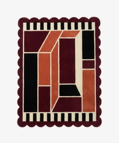 Top down view of the Burnt Frame rug featuring a neutral wool center framed by a rich burnt orange and brown border, finished with custom scalloped edges.