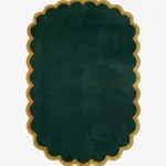Top down view of the Forest Royale rug featuring a solid deep emerald green center framed by a luxurious gold scalloped border.