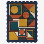 Top down view of the Harvest Loom rug featuring a complex geometric pattern of circles and squares in warm harvest tones of rust, mustard, and teal, finished with custom scalloped edges.