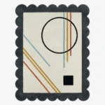 Top down view of the Incorix rug featuring a sophisticated modern geometric pattern with clean lines in high-quality wool, finished with custom scalloped edges.