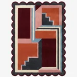 Top down view of the Inverse Staircase rug featuring a bold geometric design with an interlocking step pattern creating an optical depth effect, finished with custom scalloped edges.