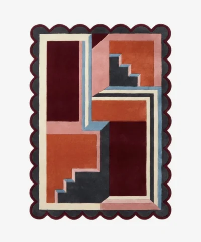 Top down view of the Inverse Staircase rug featuring a bold geometric design with an interlocking step pattern creating an optical depth effect, finished with custom scalloped edges.