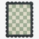 Top down view of the Lune Mist rug featuring a serene grey and off-white wool background with abstract crescent-inspired curves, finished with custom scalloped edges.