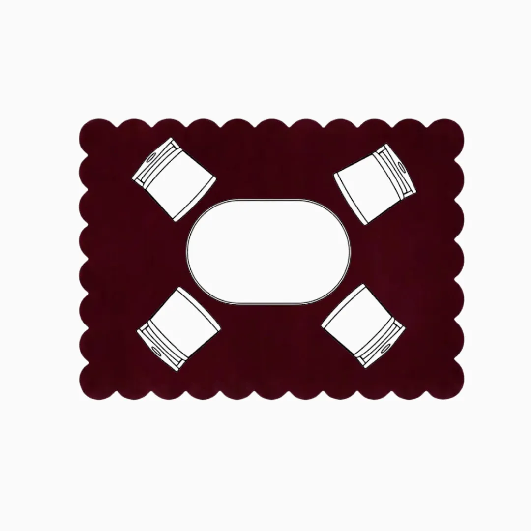 Top down diagram of a medium dining room layout showing an oval table and four chairs centered on an 8x10 rectangular scalloped rug, illustrating ample coverage for chairs to slide out safely.