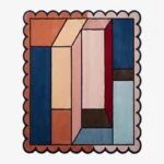 Top down view of the Muted Studio Square Rug featuring a contemporary design in soft, muted tones of beige and grey, designed to complement a modern creative space, finished with custom scalloped edges.