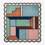 Top down view of the Pastel Pocket Square rug featuring a geometric color block design in mint green, light blue, pink, and rust, framed by a cream scalloped border.
