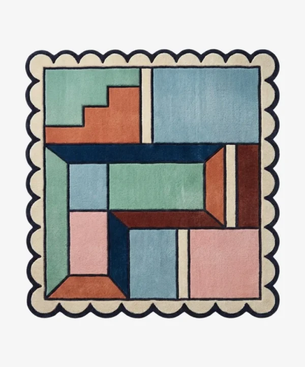 Top down view of the Pastel Pocket Square rug featuring a geometric color block design in mint green, light blue, pink, and rust, framed by a cream scalloped border.