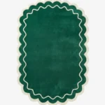 Top down view of the Pine Estate rug featuring a solid pine green wool background with a decorative cream wavy line and scalloped border.
