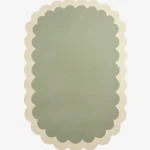 Top down view of the Pistachio Whale rug featuring a soothing ombre gradient design transitioning from sage green to soft cream, framed by a scalloped border.