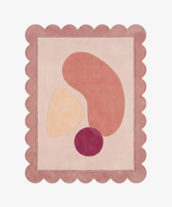 Top down view of the Rose Veil rug featuring a romantic, ethereal design with layers of soft rose pink and sheer white accents, finished with custom scalloped edges.