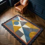 Top down view of the Saffron Drift rug featuring a mid-century modern geometric pattern with saffron yellow triangles, blue accents, and grey shapes, framed by a dark scalloped border.