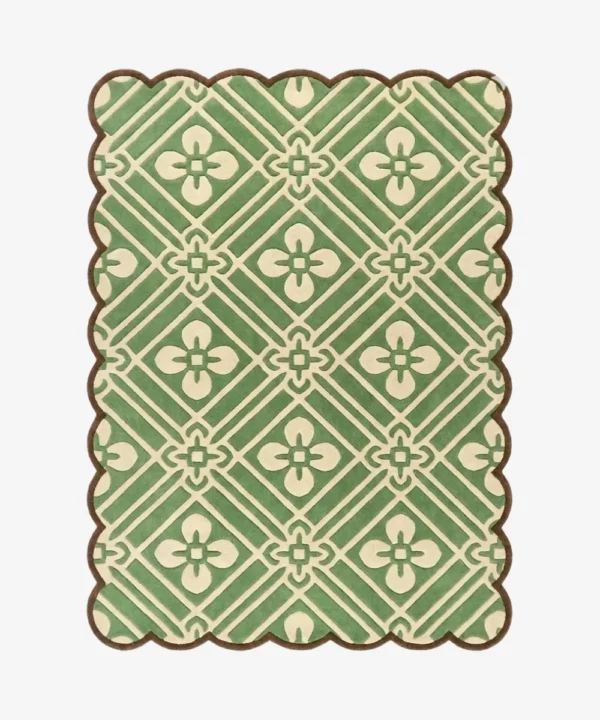 Top-down view of the Sage Dream rug against a white background, featuring an intricate repeating geometric lattice pattern with four-petal floral motifs in cream over a sage green background, framed by a continuous brown scalloped border.
