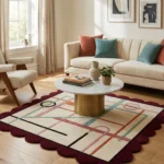 High angle view of the Sienna Veil Square rug, highlighting the deep sienna scalloped border and the modern Art Deco inspired linear design.