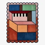 Top down view of the Studio Block rug featuring a bold geometric block pattern in modern contrasting tones on a high-quality wool background, finished with custom scalloped edges.