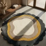 Perspective view of the Aurelith Flow round rug styled on a smooth concrete floor in a bright, modern space near a warm wooden console table, highlighting its earthy, contoured design.