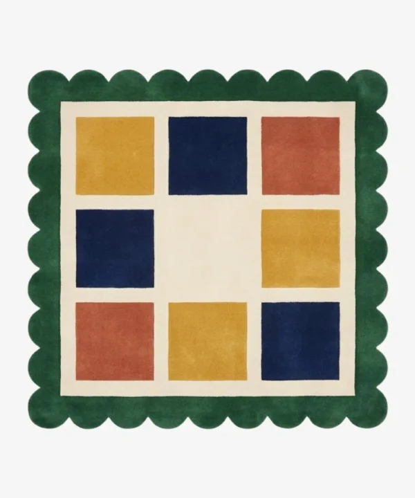 Top-down view of the square Mosaic Verve rug, featuring a cream grid with alternating colorful squares in mustard yellow, navy blue, and rust orange, all bordered by a thick forest green scalloped edge.