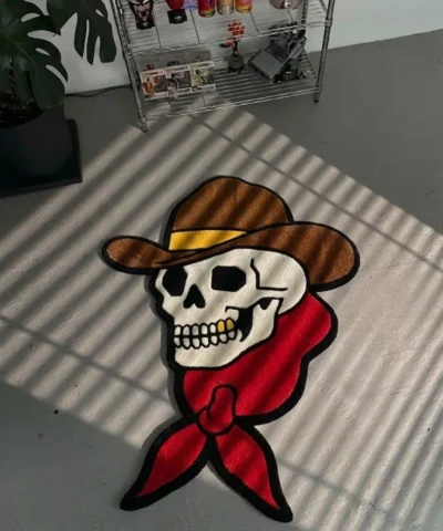 Close-up angled detail of the edge of the Cowboy Skull rug, showcasing the plush thickness of the hand-tufted pile and the clean, carved lines defining the brim of the cowboy hat.