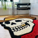 Angled perspective view of the Cowboy Skull rug, emphasizing the thick hand-tufted wool pile and the crisp 3D carving that separates the dark cowboy hat from the white skull.